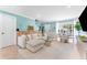 Comfortable living room showcasing a plush sofa, a glass coffee table, and stylish decor at 2809 W Platt St # 6, Tampa, FL 33609