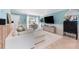 Inviting living room with a modern sofa, a TV, and elegant furnishings under bright, natural light at 2809 W Platt St # 6, Tampa, FL 33609