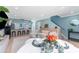 Open-concept living space featuring a modern kitchen with bar seating and a comfortable living area at 2809 W Platt St # 6, Tampa, FL 33609