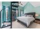 Inviting bedroom with a unique spiral staircase, high ceilings, and plenty of natural light at 2809 W Platt St # 6, Tampa, FL 33609
