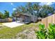 View of a cozy backyard, featuring a covered patio area and lush greenery at 2859 38Th N Ave, St Petersburg, FL 33713