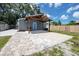 Backyard with a covered patio, pavers, and lush green grass at 2859 38Th N Ave, St Petersburg, FL 33713