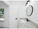 Bright bathroom with granite countertop, white sink and black faucet at 2859 38Th N Ave, St Petersburg, FL 33713