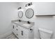 Modern bathroom vanity with double sinks, granite countertop, stylish fixtures, and sleek black hardware at 2859 38Th N Ave, St Petersburg, FL 33713