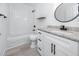 Bathroom features white vanity with granite counters, tub and shower combo and modern black fixtures at 2859 38Th N Ave, St Petersburg, FL 33713