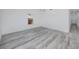 Bright bedroom featuring wood-look floors, white walls, and trim, offering a clean, modern aesthetic at 2859 38Th N Ave, St Petersburg, FL 33713