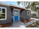 Charming home featuring a vibrant blue front door and well-maintained landscaping at 2859 38Th N Ave, St Petersburg, FL 33713