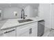 Close-up of kitchen island featuring granite countertop, stainless steel sink, and modern black faucet at 2859 38Th N Ave, St Petersburg, FL 33713