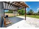 Covered patio has a concrete floor and paver extension to the grassy backyard at 2859 38Th N Ave, St Petersburg, FL 33713