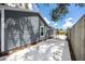 Side yard featuring a concrete driveway and fenced yard at 2859 38Th N Ave, St Petersburg, FL 33713
