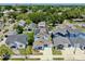 A beautiful aerial view of a neighborhood featuring a house with solar panels on the roof at 2918 N 21St St, Tampa, FL 33605