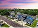 Aerial view of neighborhood with colorful homes, tree lined streets, and city skyline at 2918 N 21St St, Tampa, FL 33605