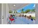 Inviting outdoor patio with comfortable seating, a dining area, lush landscaping, and a serene atmosphere at 2918 N 21St St, Tampa, FL 33605