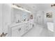 Bathroom with double vanity, large mirror, and walk-in shower next to a soaking tub at 2918 N 21St St, Tampa, FL 33605