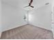This bedroom features a ceiling fan, carpet flooring, closet with double doors, and a window at 2918 N 21St St, Tampa, FL 33605