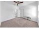 Neutral bedroom featuring a ceiling fan, carpet flooring, and a window at 2918 N 21St St, Tampa, FL 33605