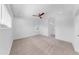 Spacious bedroom with neutral carpet, ceiling fan, and ample natural light from a window at 2918 N 21St St, Tampa, FL 33605
