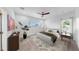 Bedroom with ceiling fan, window, and decorative plants creating a cozy, relaxing atmosphere at 2918 N 21St St, Tampa, FL 33605