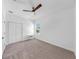Bright bedroom with a ceiling fan, carpet floors, and a window for natural lighting at 2918 N 21St St, Tampa, FL 33605