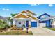 Charming home featuring a colorful front door, landscaped yard, and a one car garage at 2918 N 21St St, Tampa, FL 33605