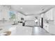 Open concept kitchen with white cabinets, stainless steel appliances, and gray tile floor at 2918 N 21St St, Tampa, FL 33605