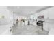 This spacious kitchen features white cabinets, stainless steel appliances, and an island at 2918 N 21St St, Tampa, FL 33605