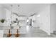 Modern, all-white kitchen featuring stainless steel appliances, quartz countertops, and stylish pendant lighting at 2918 N 21St St, Tampa, FL 33605