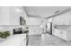 Bright, modern kitchen with sleek white cabinets, stainless steel appliances, and tile flooring at 2918 N 21St St, Tampa, FL 33605