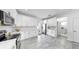 Bright kitchen featuring white cabinets, quartz countertops, modern fixtures and stainless appliances at 2918 N 21St St, Tampa, FL 33605