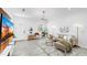 A modern living room with tiled floors and thoughtfully curated decor, creating a welcoming space at 2918 N 21St St, Tampa, FL 33605