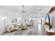 Open-concept living space with modern furnishings, contemporary lighting, and tile flooring at 2918 N 21St St, Tampa, FL 33605