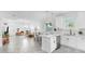 Open-concept living room and kitchen with modern decor, stainless steel appliances, and lots of natural light at 2918 N 21St St, Tampa, FL 33605