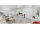 Bright living room with modern lighting, tile floors, and an open floor plan at 2918 N 21St St, Tampa, FL 33605