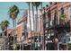 Charming street view featuring historic buildings and lush palm trees, capturing an inviting neighborhood setting at 2918 N 21St St, Tampa, FL 33605
