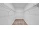 Carpeted walk-in closet with wire shelving on the walls and a clean, organized look at 2918 N 21St St, Tampa, FL 33605