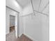 Walk-in closet with carpet flooring, wire shelving, and an adjacent walk-in closet at 2918 N 21St St, Tampa, FL 33605