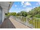 Inviting back porch with serene lake views and comfortable seating area at 3012 Grand View Ave, Clearwater, FL 33759
