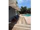 Backyard area with a sparkling pool, seating, and lush landscaping at 3012 Grand View Ave, Clearwater, FL 33759