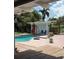 Relaxing backyard pool with a spacious wooden and brick deck, perfect for outdoor entertaining at 3012 Grand View Ave, Clearwater, FL 33759