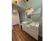 Bright and modern bathroom with double vanity, stylish lighting, and tile detail at 3012 Grand View Ave, Clearwater, FL 33759