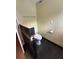 Modern bathroom featuring a textured wall, toilet, and stylish fixtures at 3012 Grand View Ave, Clearwater, FL 33759