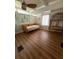 Bright bedroom features wood floors, a ceiling fan and a decorative rattan shelf at 3012 Grand View Ave, Clearwater, FL 33759