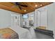 Comfortable bedroom features a wood ceiling, fan, and access to other rooms at 3012 Grand View Ave, Clearwater, FL 33759