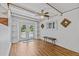 Bright bonus room with outside pool view, built-in shelves, and laminate floors at 3012 Grand View Ave, Clearwater, FL 33759