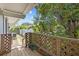 Wooden deck overlooking the backyard, with a view of the lush greenery and landscaping at 3012 Grand View Ave, Clearwater, FL 33759