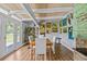 Charming dining room featuring wood floors, white trim, and views of the water at 3012 Grand View Ave, Clearwater, FL 33759