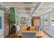 Cozy dining room with view to the living room, features a stone fireplace at 3012 Grand View Ave, Clearwater, FL 33759