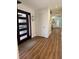 Welcoming entryway featuring modern front door and built-in shelves at 3012 Grand View Ave, Clearwater, FL 33759