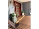 Inviting entryway featuring a wood door, ample natural light, and spacious wood porch at 3012 Grand View Ave, Clearwater, FL 33759