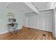 Bright flex room with wood laminate flooring, built-in storage and an abundance of natural light at 3012 Grand View Ave, Clearwater, FL 33759